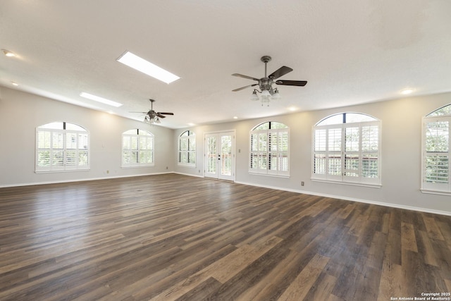 18510 Paloma Wood, San Antonio, TX 78259 - unfurnished living room with dark wood-style floors, a ceiling fan, recessed lighting, and a skylight