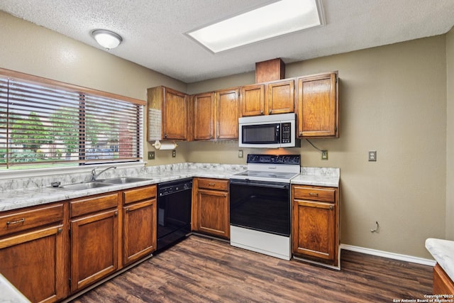 11063 Moonlit, San Antonio, TX 78249 - kitchen featuring stainless steel microwave, black dishwasher, electric stove, light countertops, and dark wood-style flooring