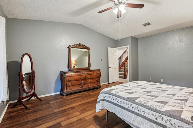 11063 Moonlit, San Antonio, TX 78249 - bedroom with wood finished floors, vaulted ceiling, a textured ceiling, and a ceiling fan