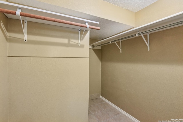 11063 Moonlit, San Antonio, TX 78249 - walk in closet featuring light tile patterned floors