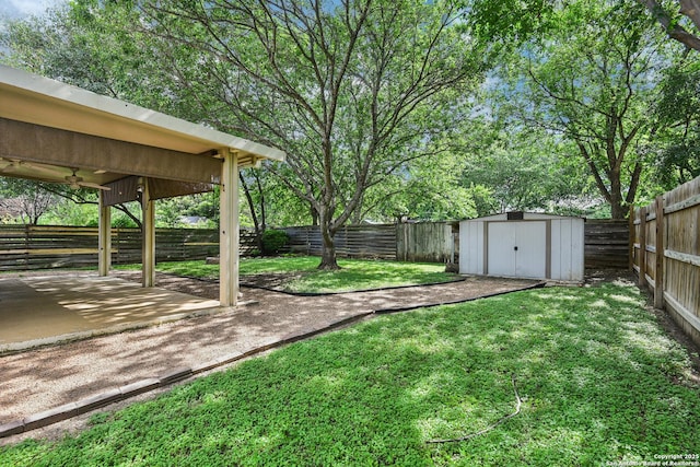 11063 Moonlit, San Antonio, TX 78249 - fenced backyard featuring a ceiling fan, a patio, and a storage shed