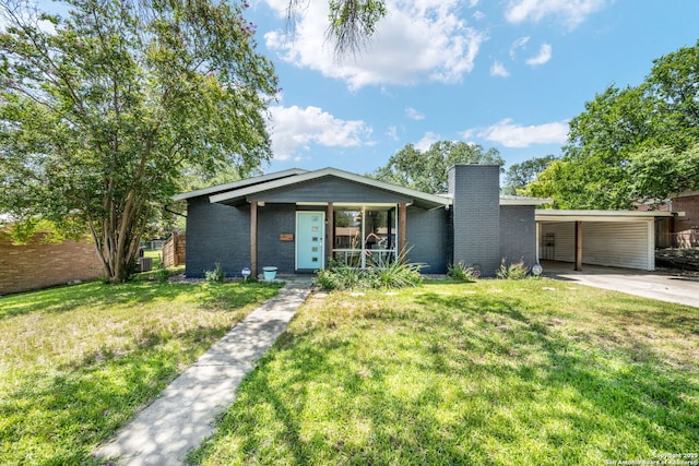 250 Maplewood, San Antonio, TX 78216 - mid-century home featuring brick siding, a chimney, a front lawn, concrete driveway, and a carport