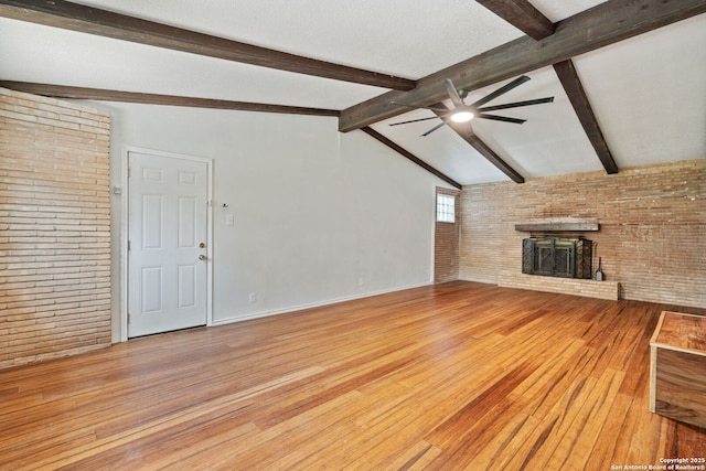 250 Maplewood, San Antonio, TX 78216 - unfurnished living room with ceiling fan, hardwood / wood-style floors, brick wall, and a fireplace