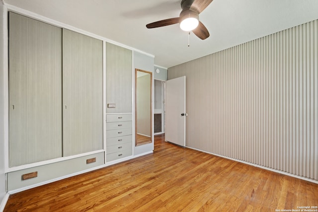 250 Maplewood, San Antonio, TX 78216 - unfurnished bedroom with wood finished floors, a closet, and ceiling fan