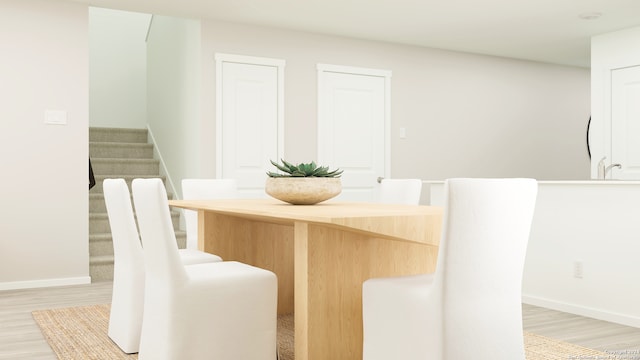 110 Speargrass Ln, Odem, TX 78370 - dining space featuring stairs and light wood-type flooring
