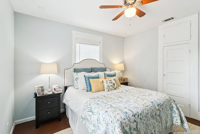 107 W Gilbert, Falls City, TX 78113 - bedroom with dark wood-style flooring and ceiling fan