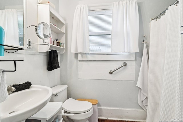 107 W Gilbert, Falls City, TX 78113 - bathroom with toilet and a shower with shower curtain