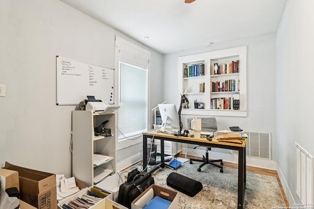 107 W Gilbert, Falls City, TX 78113 - office area with baseboards and wood finished floors