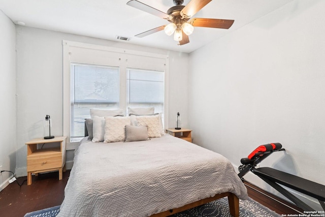107 W Gilbert, Falls City, TX 78113 - bedroom featuring a ceiling fan and wood finished floors