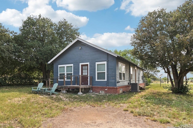 107 W Gilbert, Falls City, TX 78113 - view of front of home featuring a front lawn and crawl space