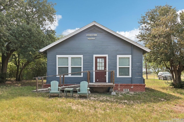 107 W Gilbert, Falls City, TX 78113 - rear view of property with a lawn