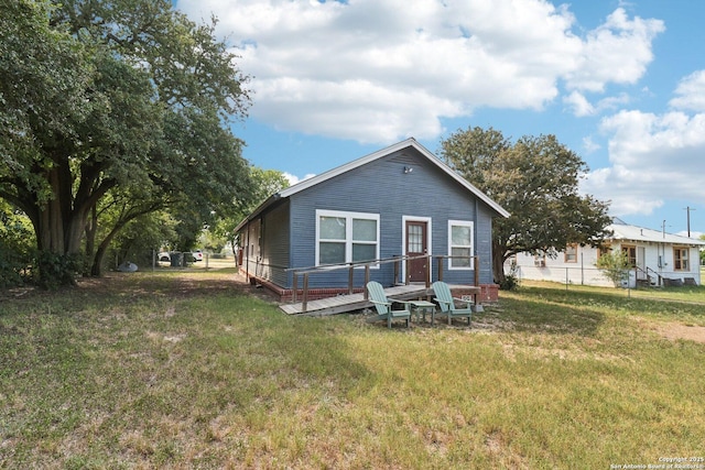 107 W Gilbert, Falls City, TX 78113 - rear view of house featuring a deck