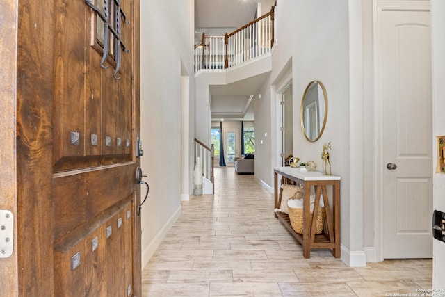 11910 Wilby, San Antonio, TX 78253 - foyer entrance with stairs, a towering ceiling, and light wood-type flooring