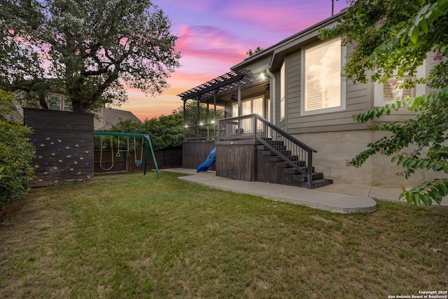 11910 Wilby, San Antonio, TX 78253 - yard at dusk featuring a playground, a pergola, and stairs