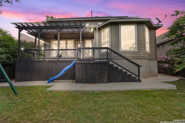 11910 Wilby, San Antonio, TX 78253 - back of property featuring a pergola, a playground, a ceiling fan, and stairway