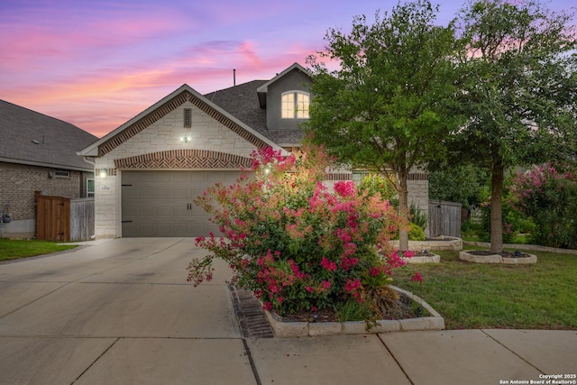 11910 Wilby, San Antonio, TX 78253 - view of front of home with stone siding, an attached garage, and concrete driveway