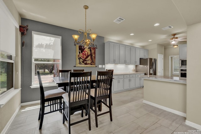 577 River Chase, New Braunfels, TX 78132 - dining space featuring plenty of natural light, a chandelier, a ceiling fan, recessed lighting, and light tile patterned floors