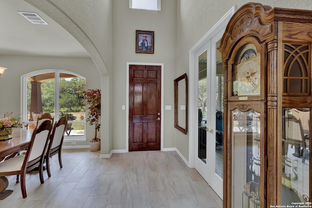 577 River Chase, New Braunfels, TX 78132 - foyer with arched walkways and french doors