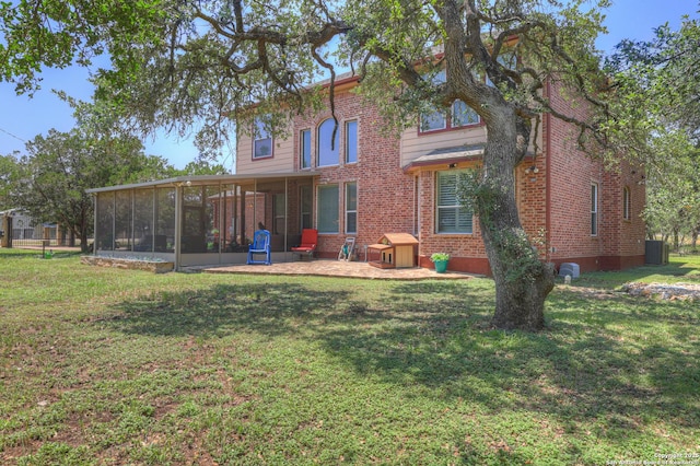 577 River Chase, New Braunfels, TX 78132 - back of house featuring a sunroom, brick siding, a yard, and a patio