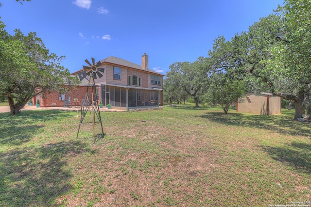 577 River Chase, New Braunfels, TX 78132 - view of green lawn featuring a sunroom and a storage shed