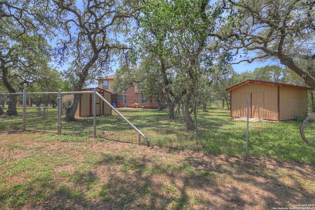 577 River Chase, New Braunfels, TX 78132 - view of yard featuring a storage unit