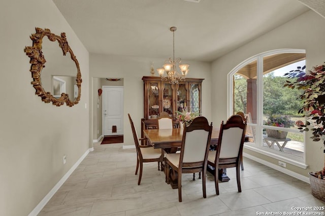 577 River Chase, New Braunfels, TX 78132 - dining room with healthy amount of natural light and a chandelier