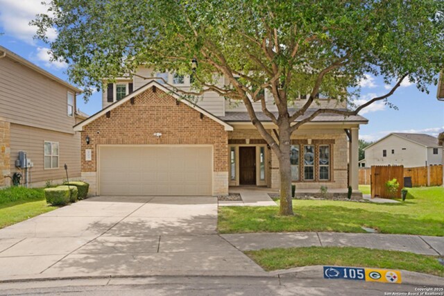 105 Highland Pl, Cibolo, TX 78108 - view of front of property featuring brick siding, a garage, and driveway