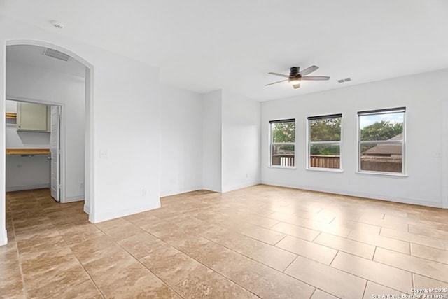 105 Highland Pl, Cibolo, TX 78108 - spare room featuring ceiling fan, arched walkways, and a smoke detector