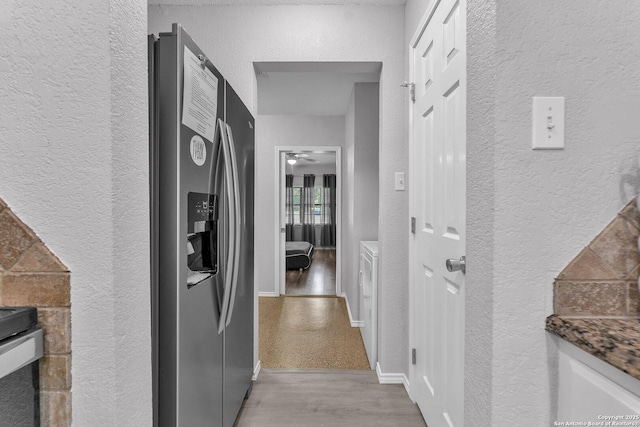 139 Navajo Cir, Cibolo, TX 78108 - hallway with a textured wall and light wood finished floors