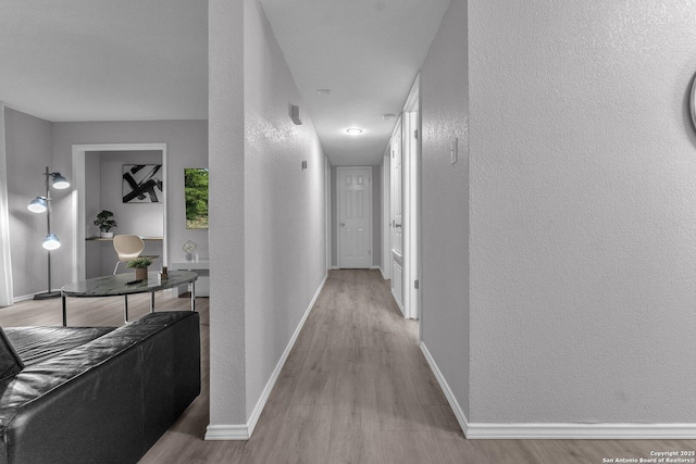 139 Navajo Cir, Cibolo, TX 78108 - hallway featuring a textured wall and wood finished floors