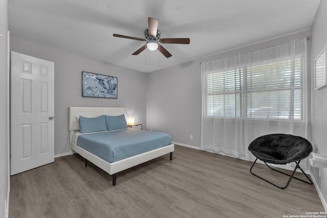 139 Navajo Cir, Cibolo, TX 78108 - bedroom featuring light wood-type flooring and a ceiling fan