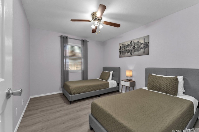 139 Navajo Cir, Cibolo, TX 78108 - bedroom with wood finished floors and a ceiling fan