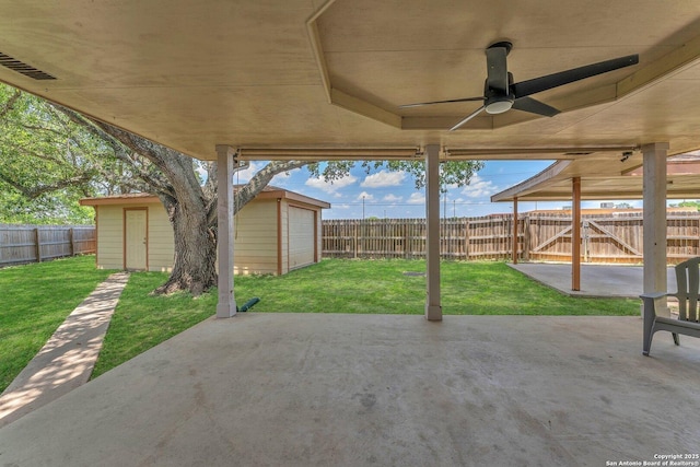 139 Navajo Cir, Cibolo, TX 78108 - fenced backyard featuring a patio area, ceiling fan, and an outbuilding
