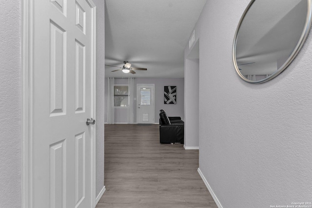 139 Navajo Cir, Cibolo, TX 78108 - corridor featuring baseboards and wood finished floors