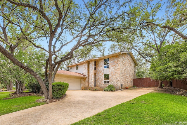 14339 Hill Prince, San Antonio, TX 78248 - view of front facade featuring an attached garage, concrete driveway, and stone siding