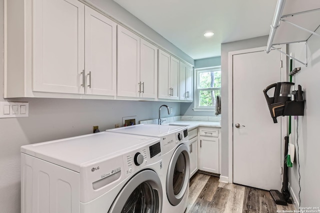 14339 Hill Prince, San Antonio, TX 78248 - washroom featuring cabinet space, separate washer and dryer, light wood finished floors, and recessed lighting