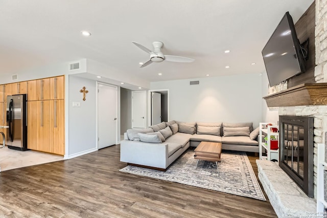 14339 Hill Prince, San Antonio, TX 78248 - living room with a fireplace, a ceiling fan, light wood-type flooring, and recessed lighting