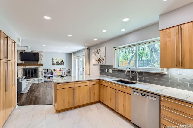 14339 Hill Prince, San Antonio, TX 78248 - kitchen featuring stainless steel dishwasher, a peninsula, open floor plan, recessed lighting, and light stone counters