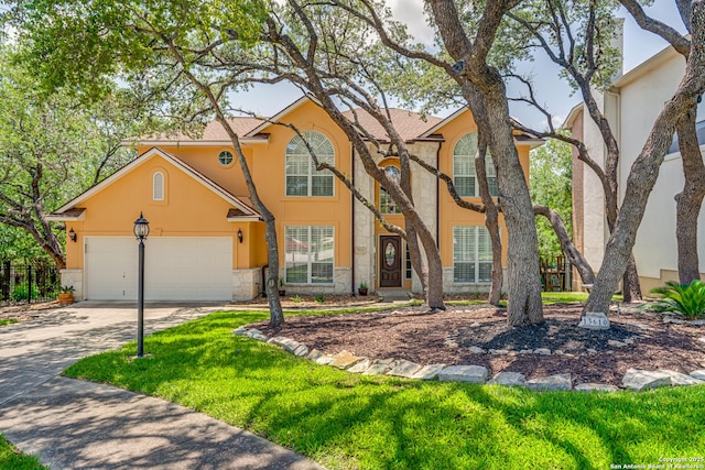 13610 Pearlstone, San Antonio, TX 78232 - traditional-style home featuring stone siding, stucco siding, driveway, and an attached garage