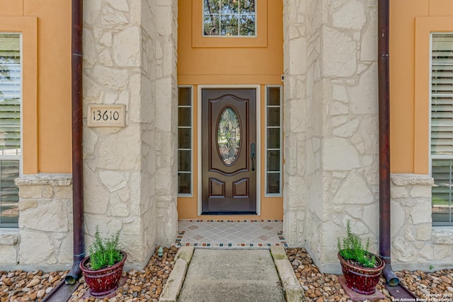 13610 Pearlstone, San Antonio, TX 78232 - doorway to property featuring stone siding
