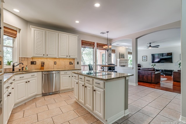 13610 Pearlstone, San Antonio, TX 78232 - kitchen with dishwasher, light tile patterned floors, arched walkways, black electric stovetop, and recessed lighting