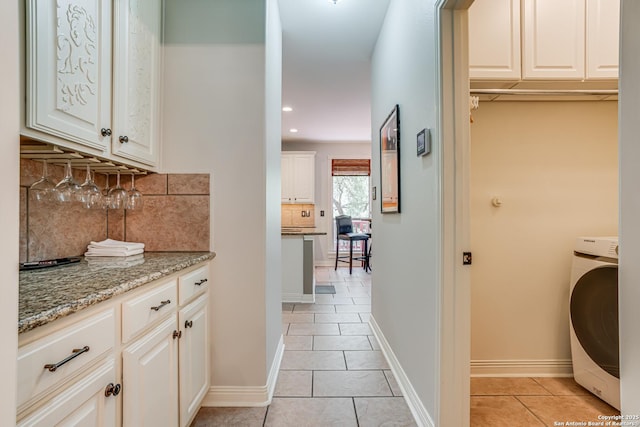 13610 Pearlstone, San Antonio, TX 78232 - laundry room featuring washer / dryer, light tile patterned floors, cabinet space, and recessed lighting