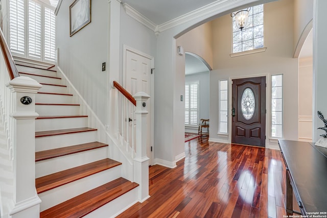 13610 Pearlstone, San Antonio, TX 78232 - entrance foyer featuring arched walkways, crown molding, plenty of natural light, hardwood / wood-style floors, and stairway