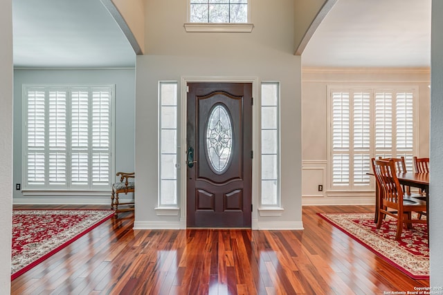 13610 Pearlstone, San Antonio, TX 78232 - foyer entrance with arched walkways, wood-type flooring, and crown molding