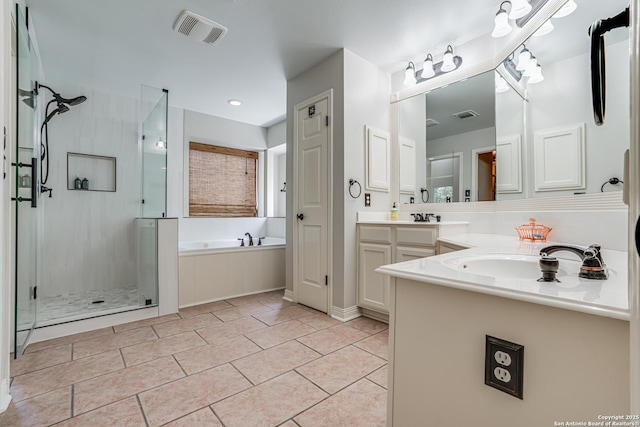 13610 Pearlstone, San Antonio, TX 78232 - full bathroom with vanity, a shower stall, a bath, and tile patterned floors