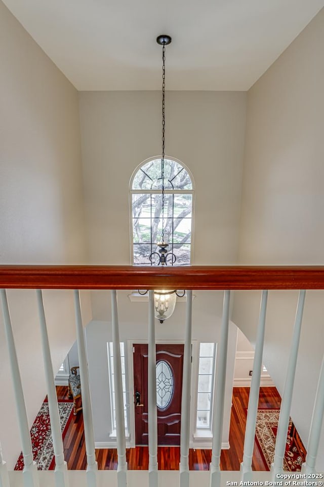 13610 Pearlstone, San Antonio, TX 78232 - foyer featuring a chandelier, wood finished floors, and stairs