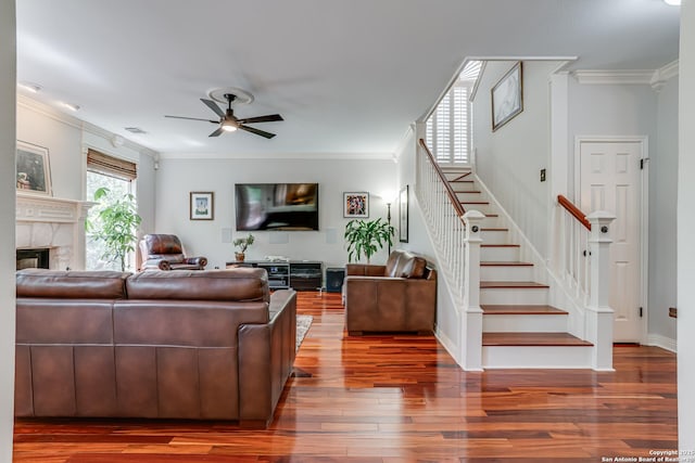 13610 Pearlstone, San Antonio, TX 78232 - living room with ornamental molding, stairway, ceiling fan, wood finished floors, and a fireplace