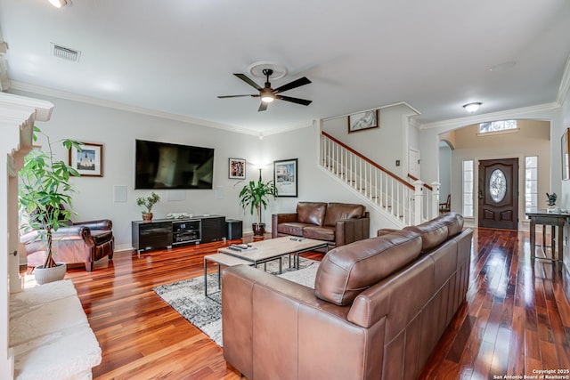13610 Pearlstone, San Antonio, TX 78232 - living area featuring ceiling fan, arched walkways, stairway, crown molding, and wood finished floors