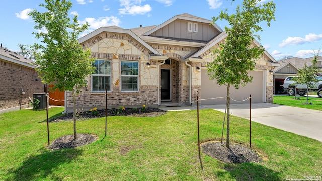 5322 Silent Dusk, Bulverde, TX 78163 - view of front of property with driveway, a garage, stone siding, a front yard, and brick siding