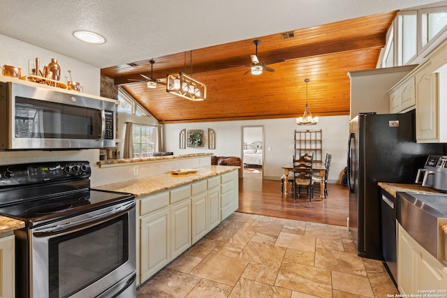611 Wild Turkey, New Braunfels, TX 78132 - kitchen featuring stainless steel appliances, ceiling fan, pendant lighting, light stone finish flooring, and lofted ceiling